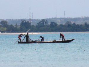 Once the boat got a fair distance away, the men aboard began throwing out a large net.